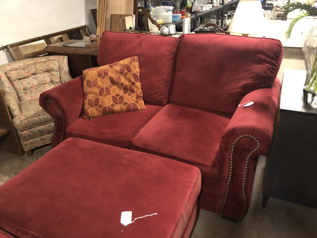 Red loveseat and matching ottoman