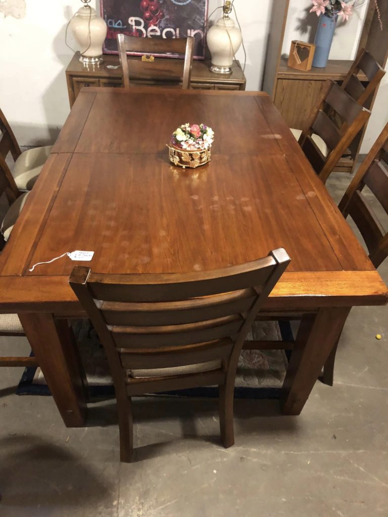 A lovely table and 8 chairs for $200.