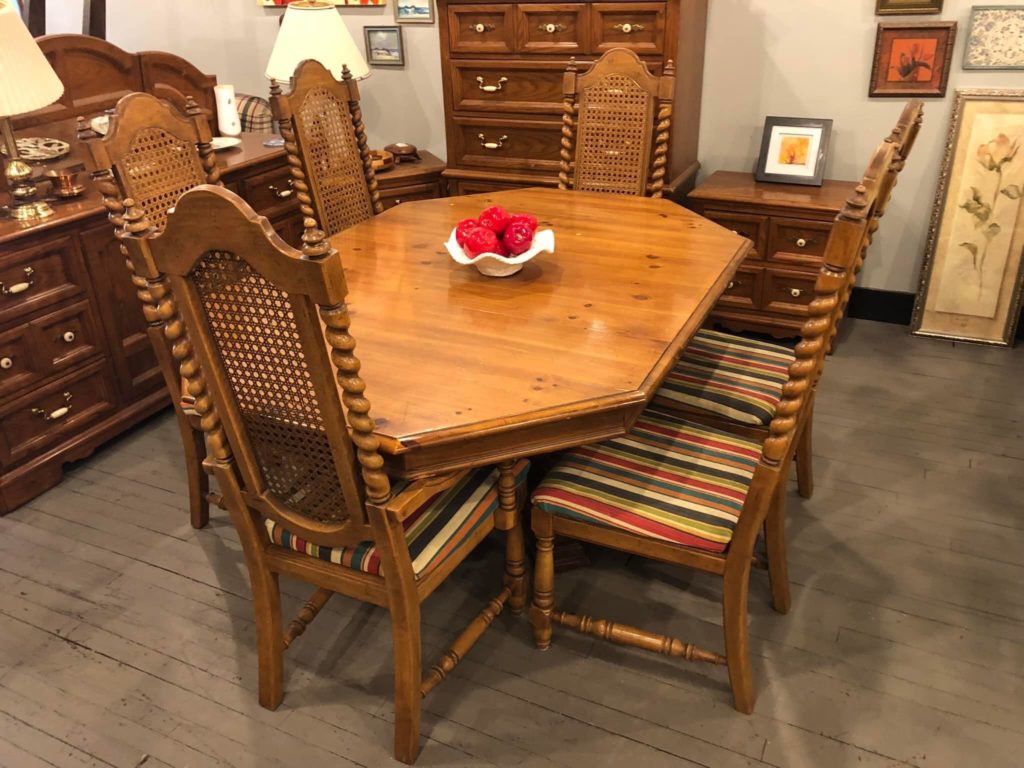 Table with 6 striped seated chairs. Original price was $475.00. Now on sale for $375.00.
